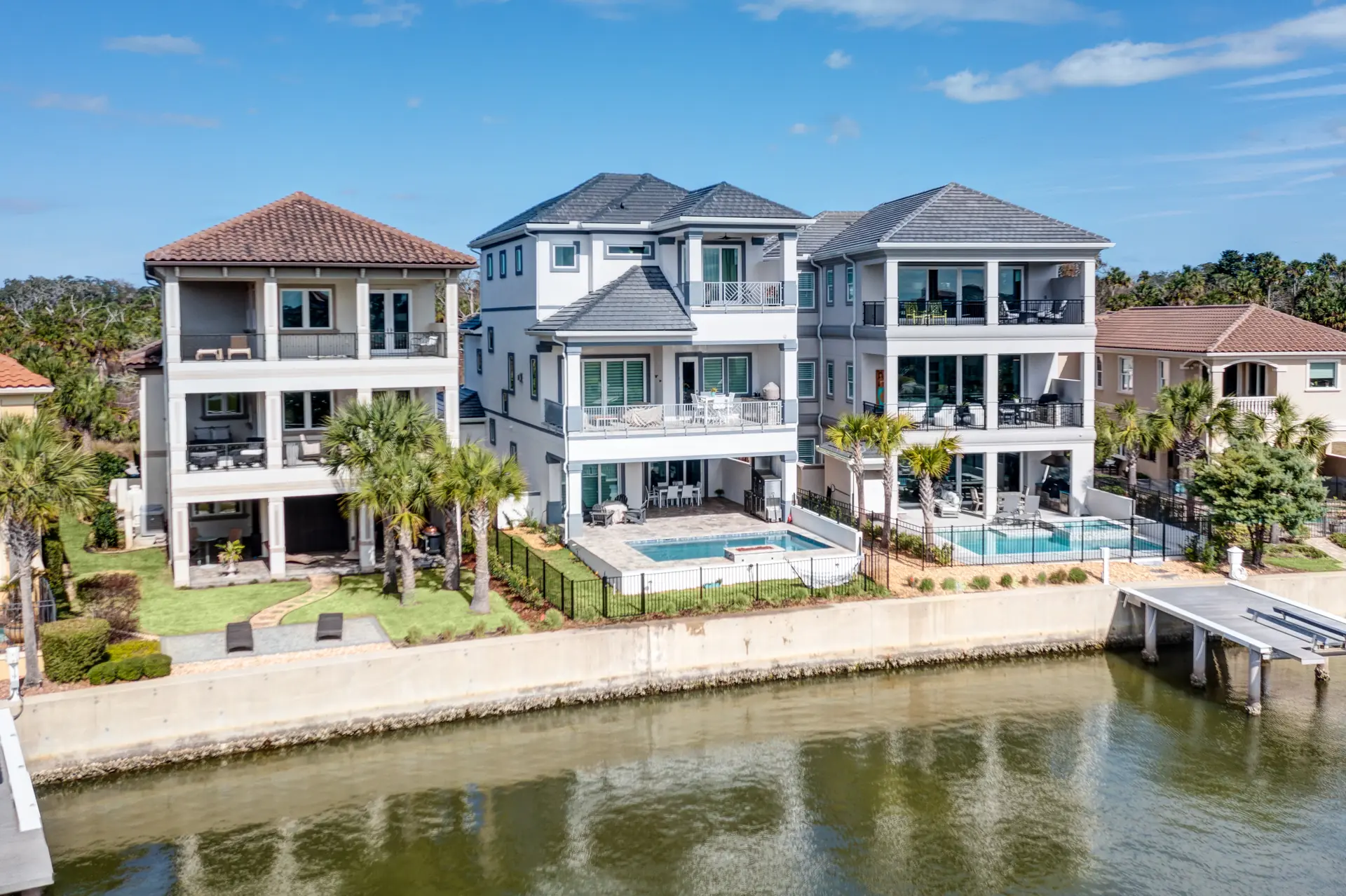 Waterfront luxury home viewed from across the canal